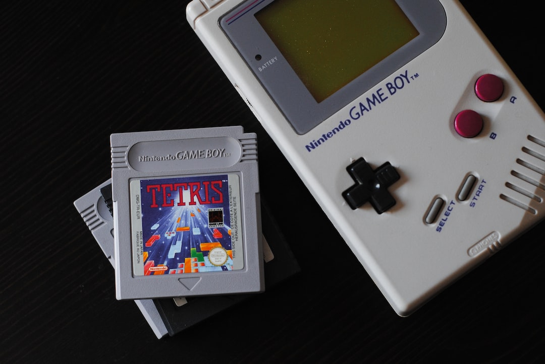 A nintendo gameboy sitting on a table.