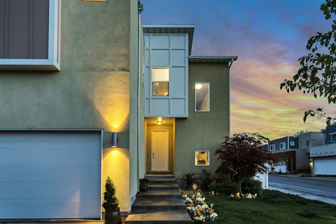 The exterior of a modern home at dusk.