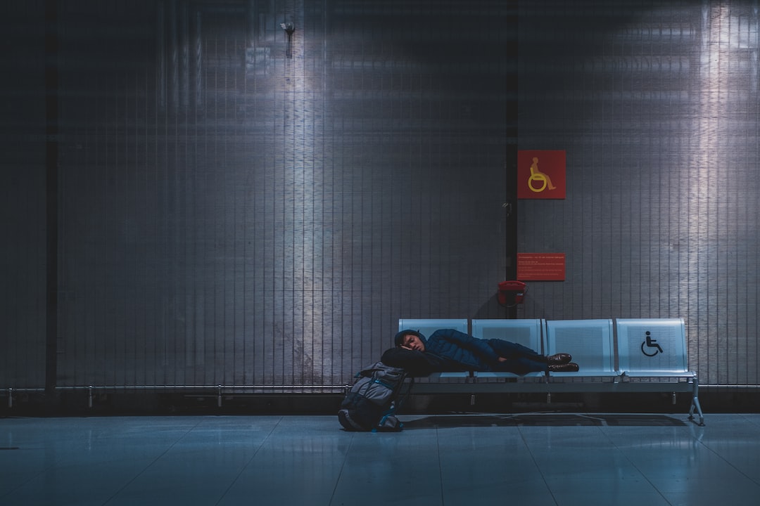 A person is sleeping on a bench.