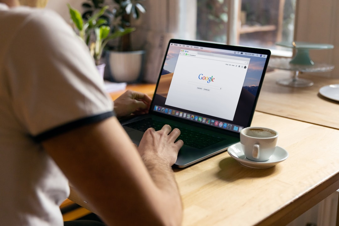 A man using a laptop with google search on it.