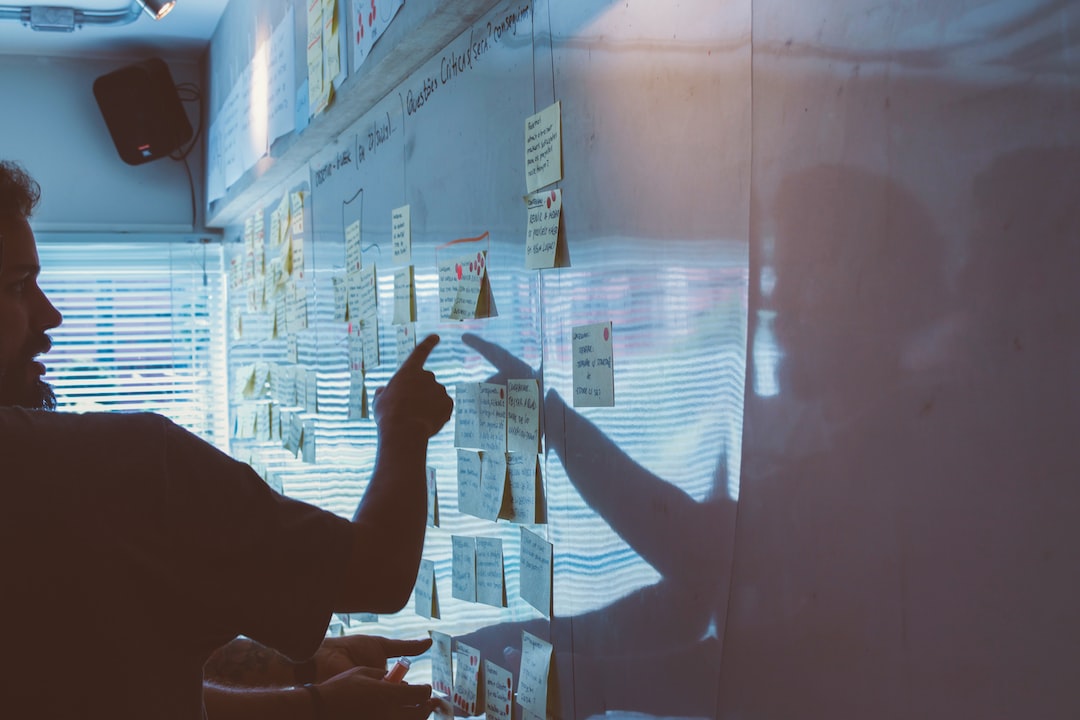 A man pointing at a whiteboard.