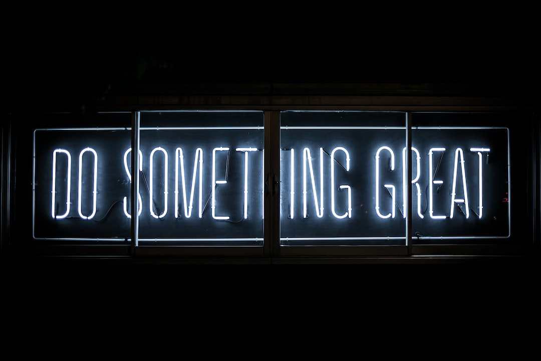 A neon sign that says do something great.