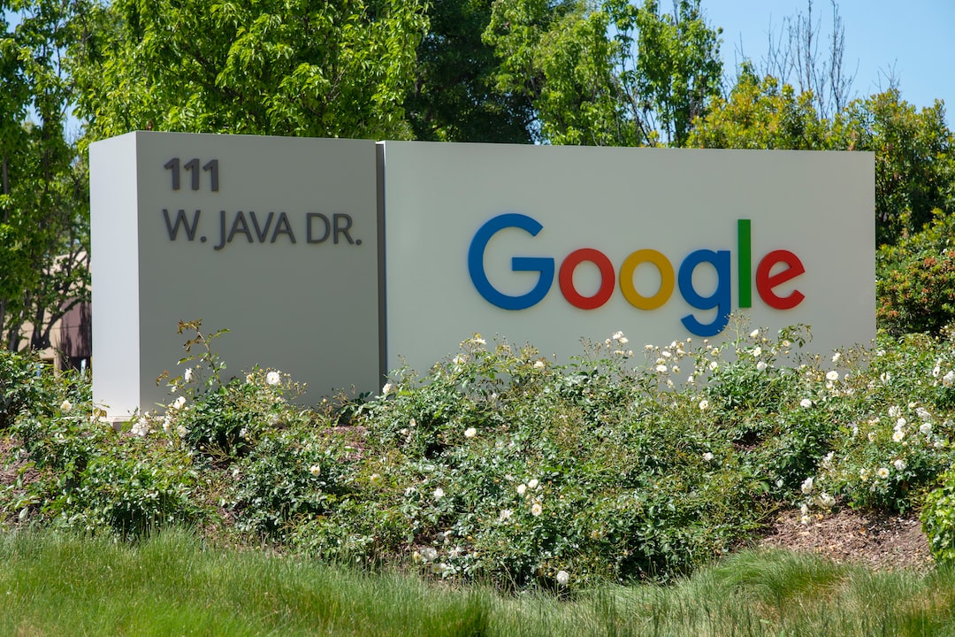 Google's java dr sign in front of bushes.