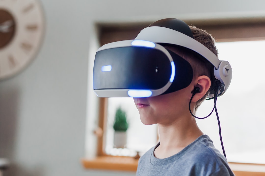 A boy wearing a vr headset in a living room.