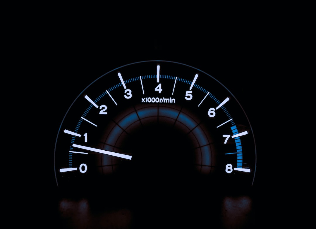 A speedometer on a black background.